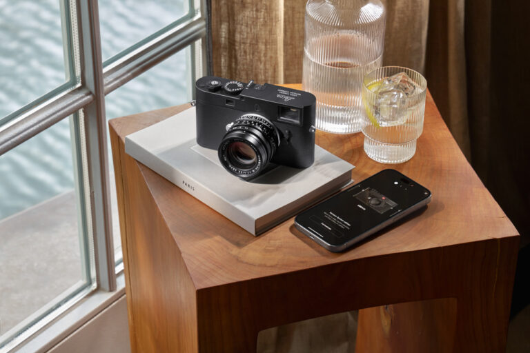 leica m11 d camera next to fotos app