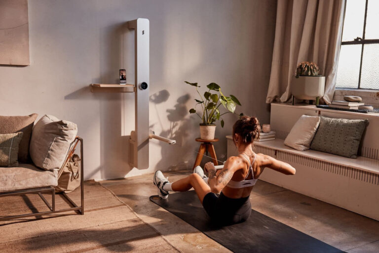 woman sitting using amp ai fitness machine